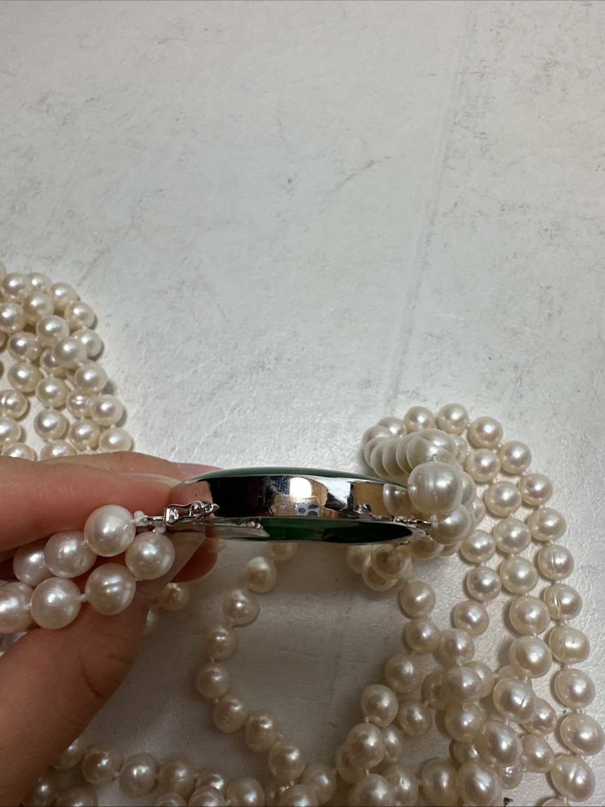 Chinese Natural Pearl Necklace, 925 Silver and a Green Stone In The Middle