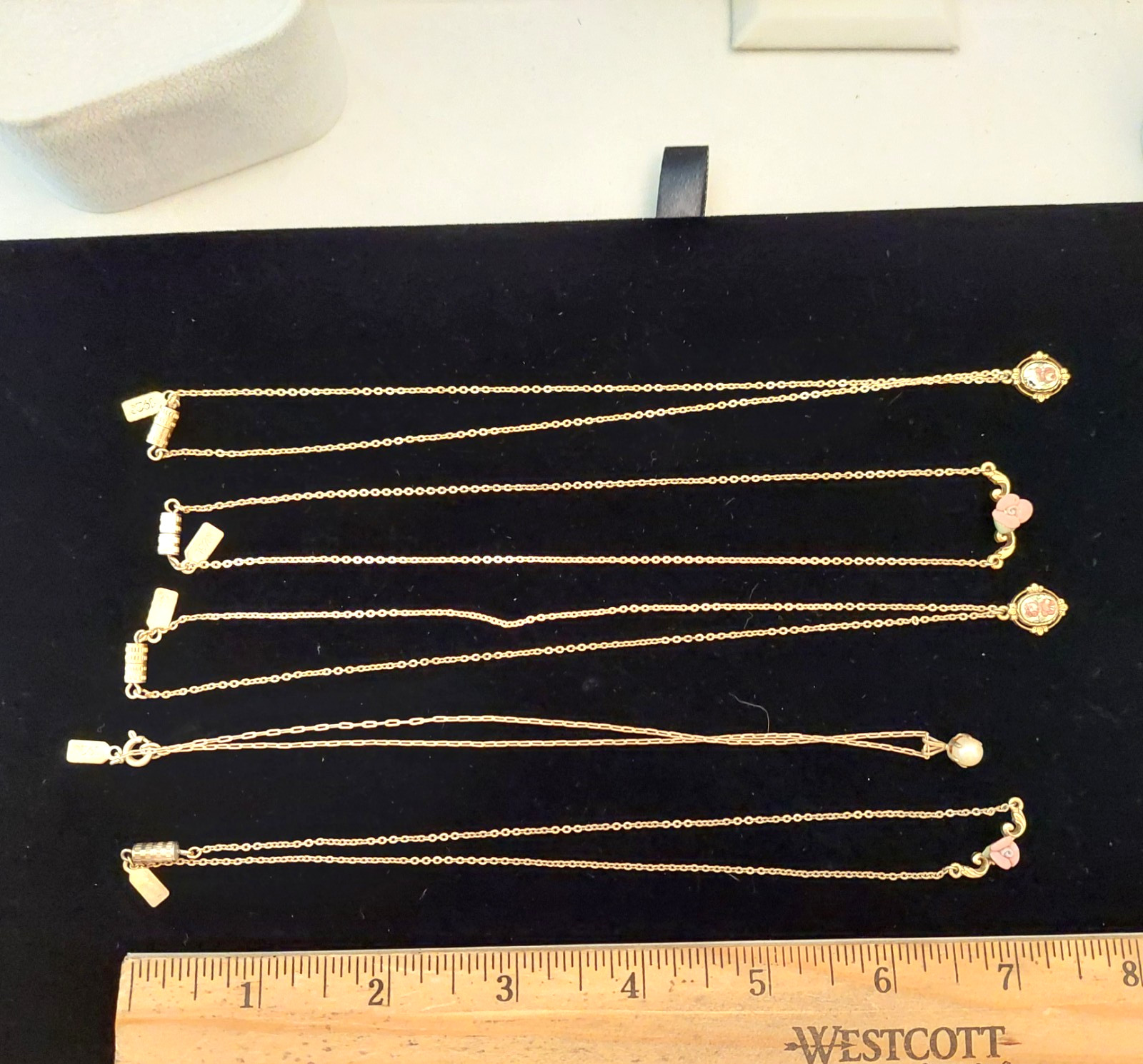 5 Gorgeous 1928 Brand Delicate Gold Tone Necklaces with various charms/looks