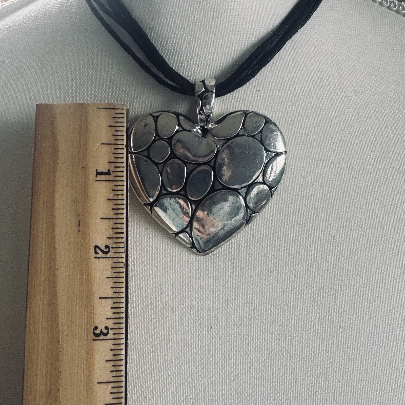 Modern silver tone pebbled heart pendant necklace on leather cording adjustable