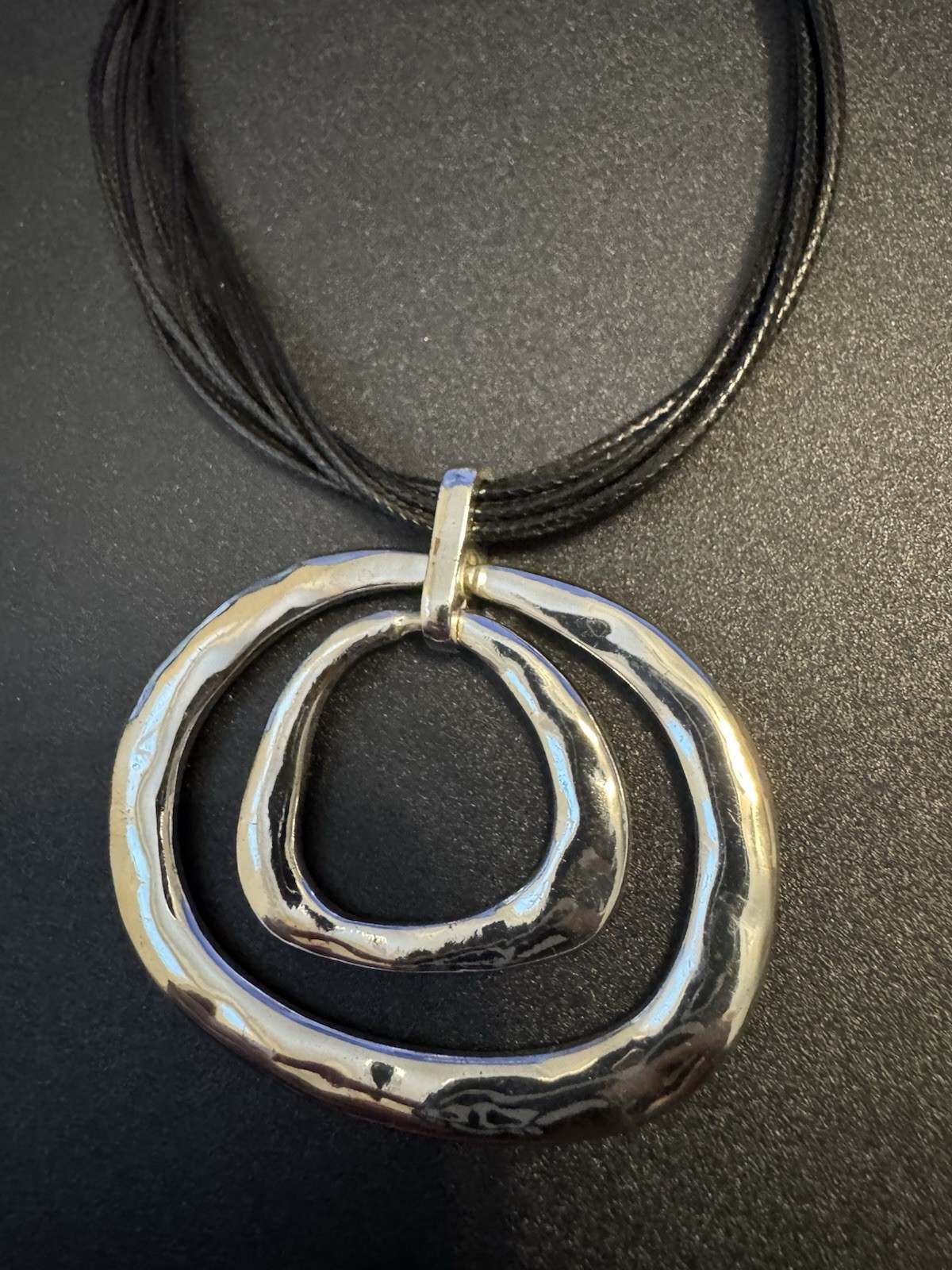 Silver Tone Hammered Metal On Multi Strand Black Cord Necklace M2