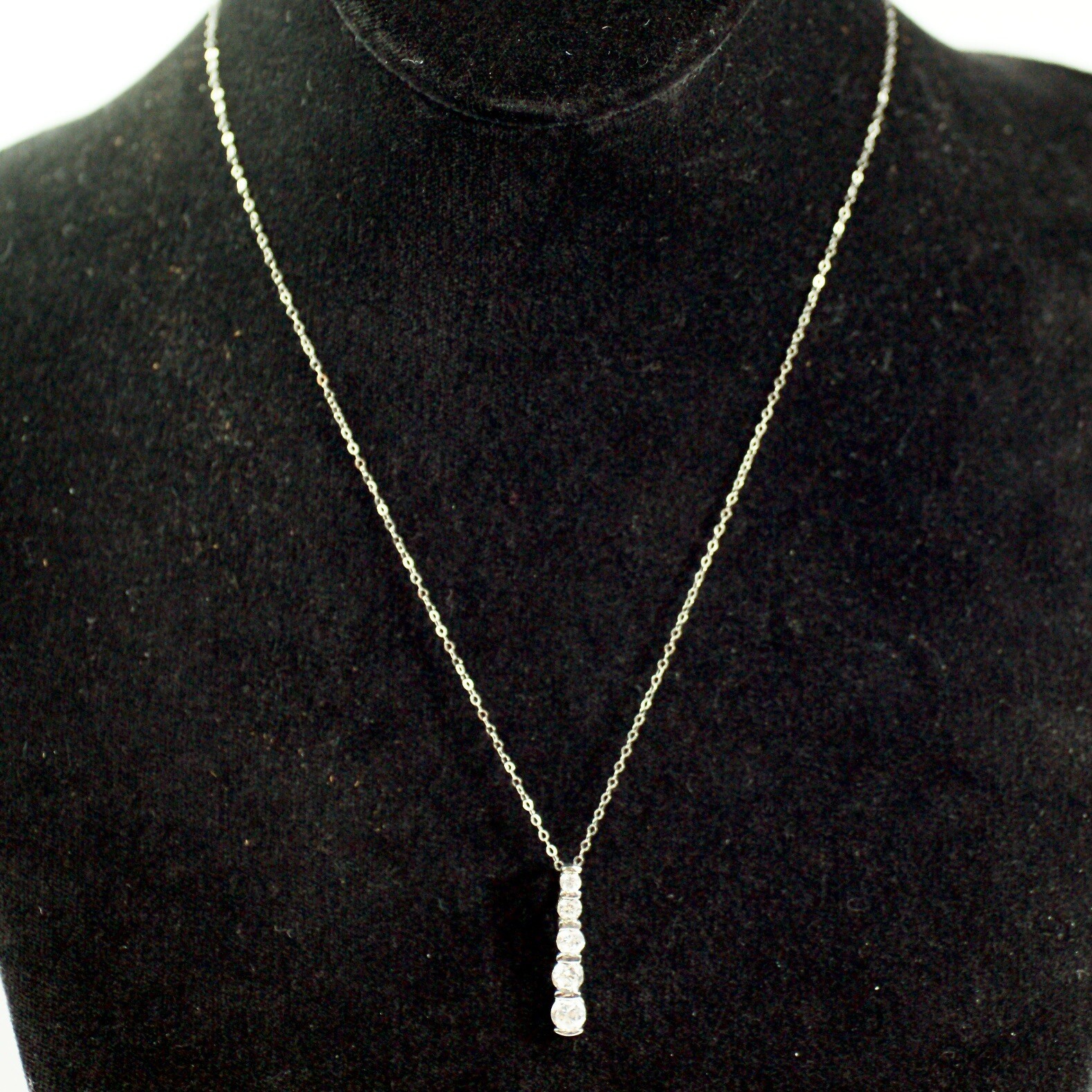 Sterling silver white/colorless CZ graduated five stone pendant necklace