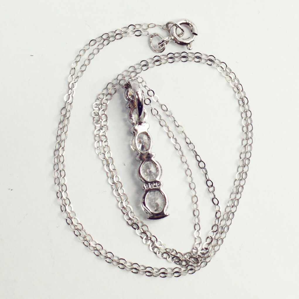 Sterling silver white/colorless CZ graduated five stone pendant necklace