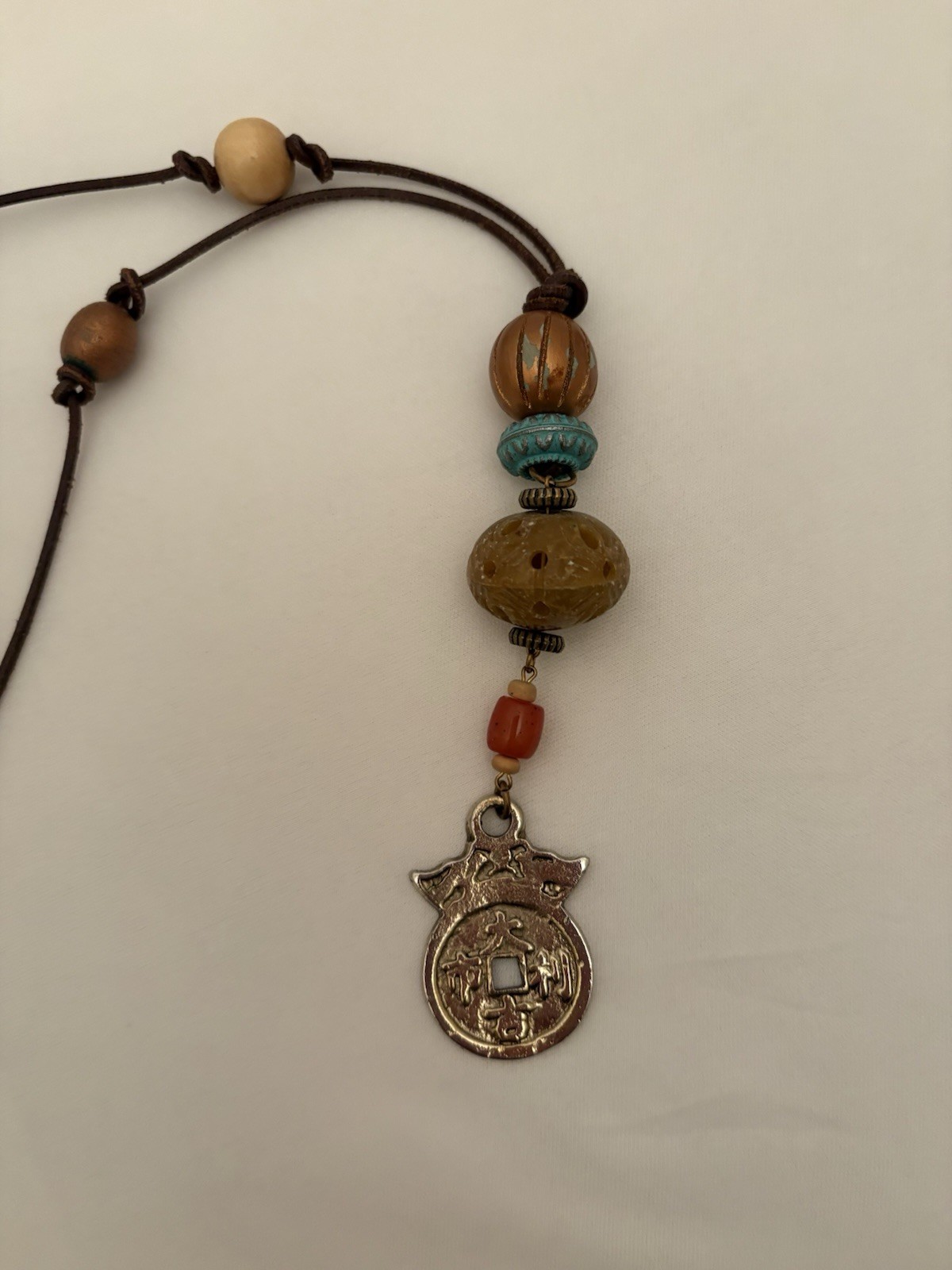 Vtg Multicolor Wood, Metal & Carved Bead Cord Necklace with Asian Charm Pendant