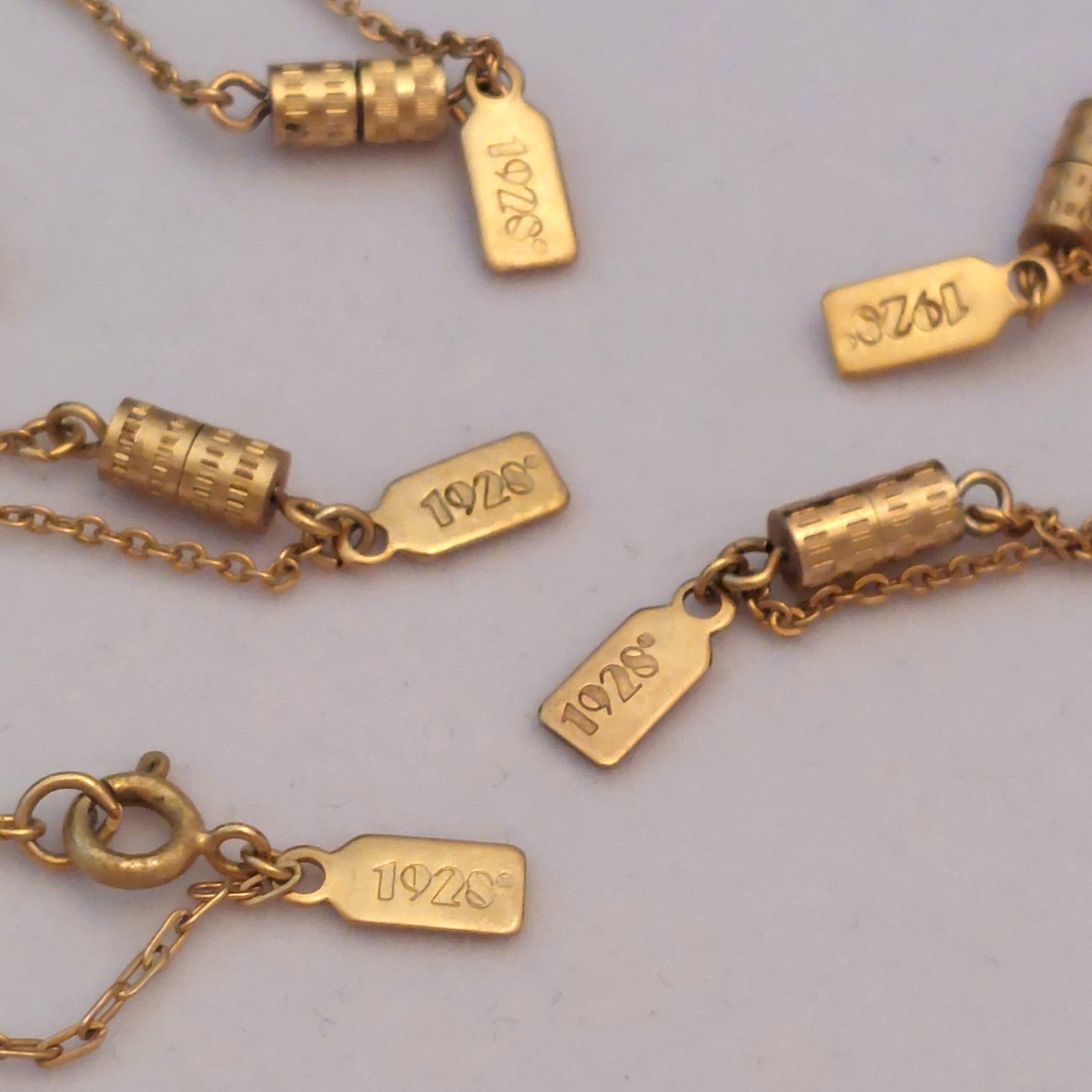 5 Gorgeous 1928 Brand Delicate Gold Tone Necklaces with various charms/looks