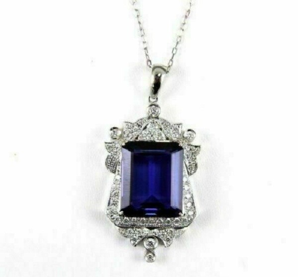 Pretty Emerald Cut Simulated Blue Sapphire Halo Pendant In 14k White Gold Plated