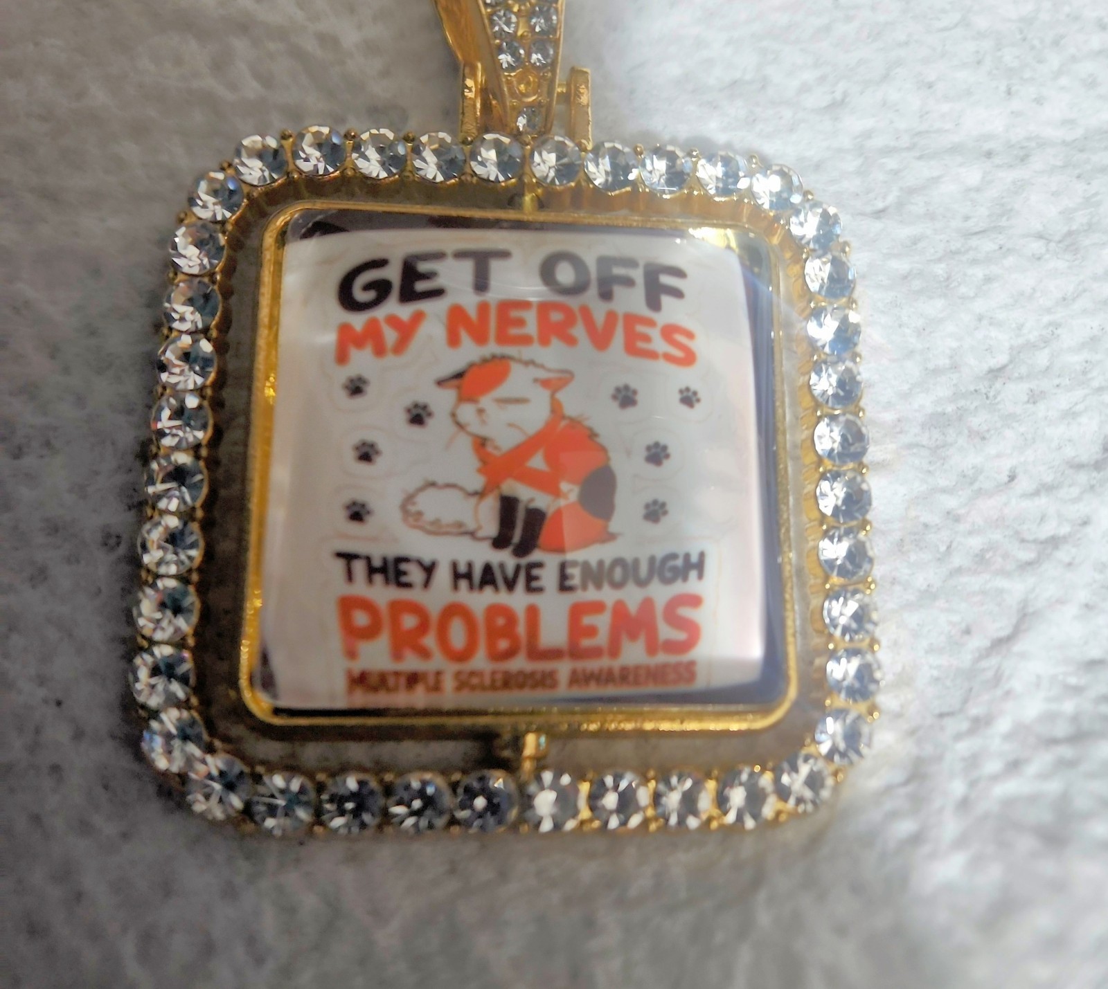 Square White Crystal Pavé Border Charm Pendant, Awareness, “GET OFF MY NERVES”