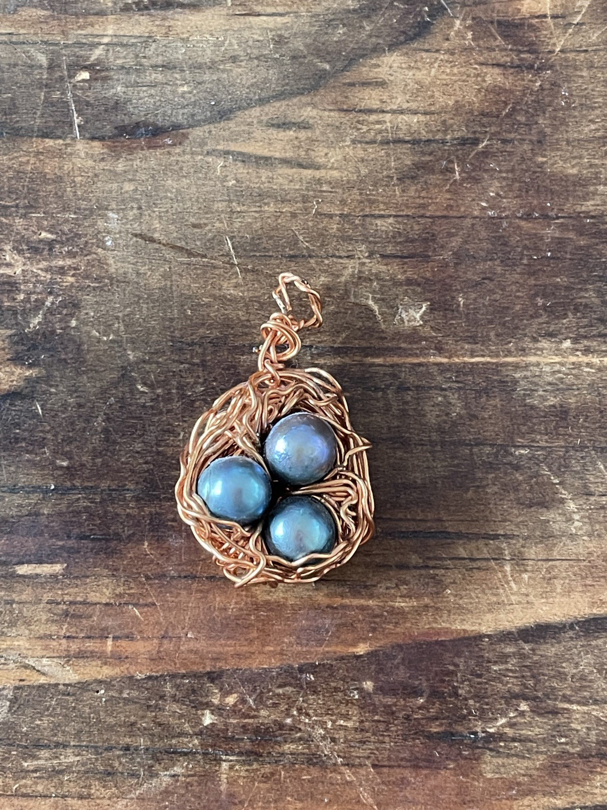 Hand crafted Copper Wire Bird’s Nest Pendant with Blue Pearls