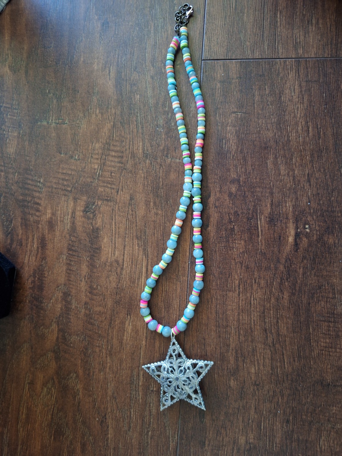 14 inch necklace with a star and multicolored and blue grey beads