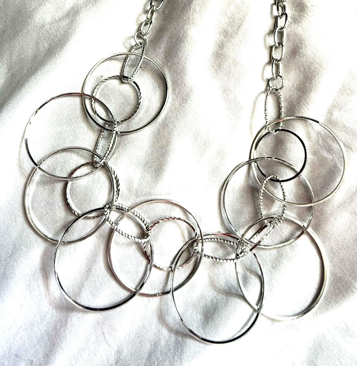 NEW Silver Tone Hoop Necklace Multiple Layers Interconnected Variated Circles