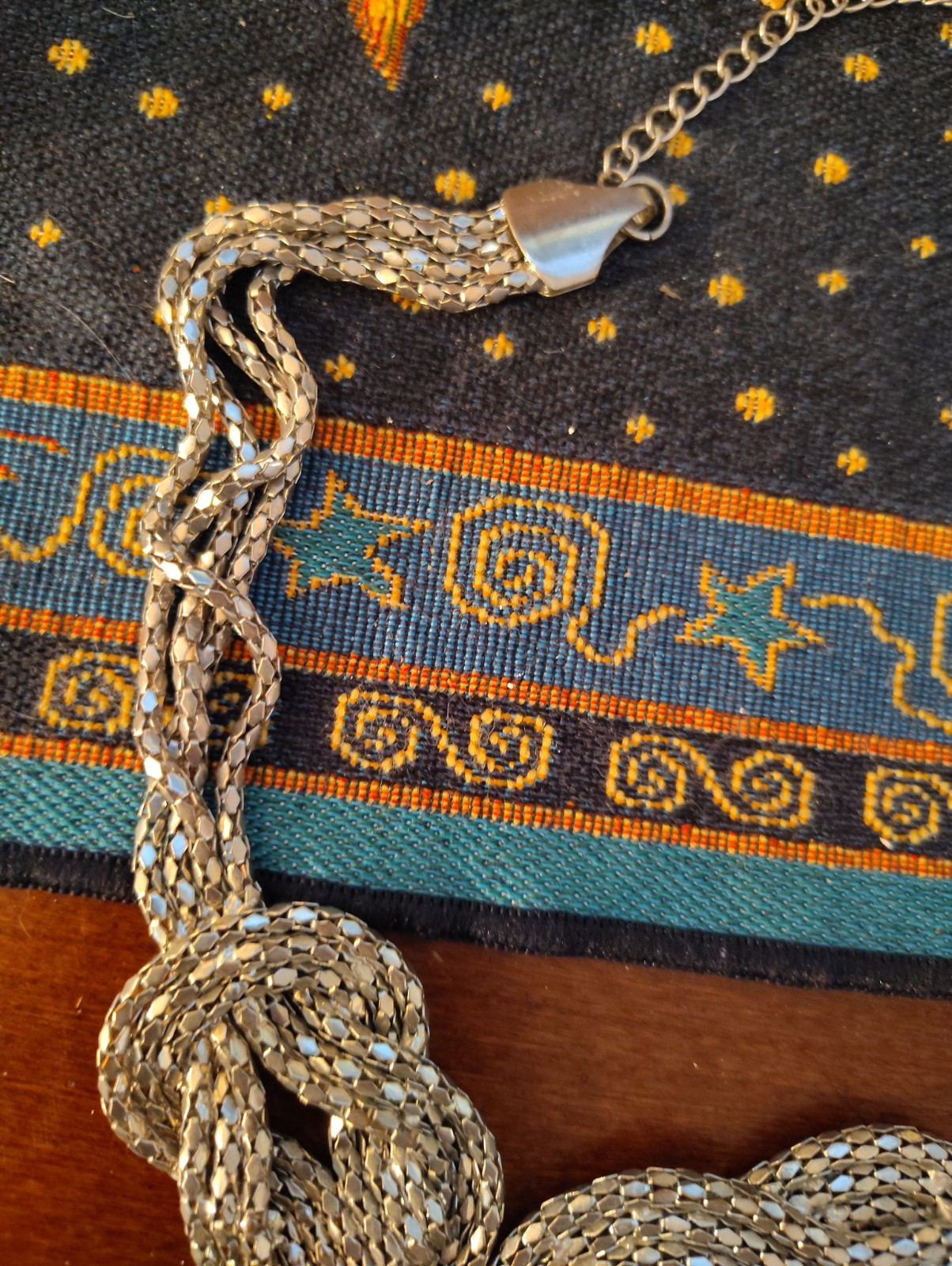 silver-tone chunky braided rope-style statement necklace three knotted details.