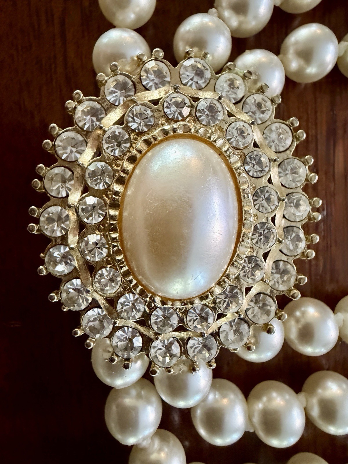 Vintage Triple‑Strand Faux Pearl Necklace w/ Ornate Oval Crystal Clasp – Classic