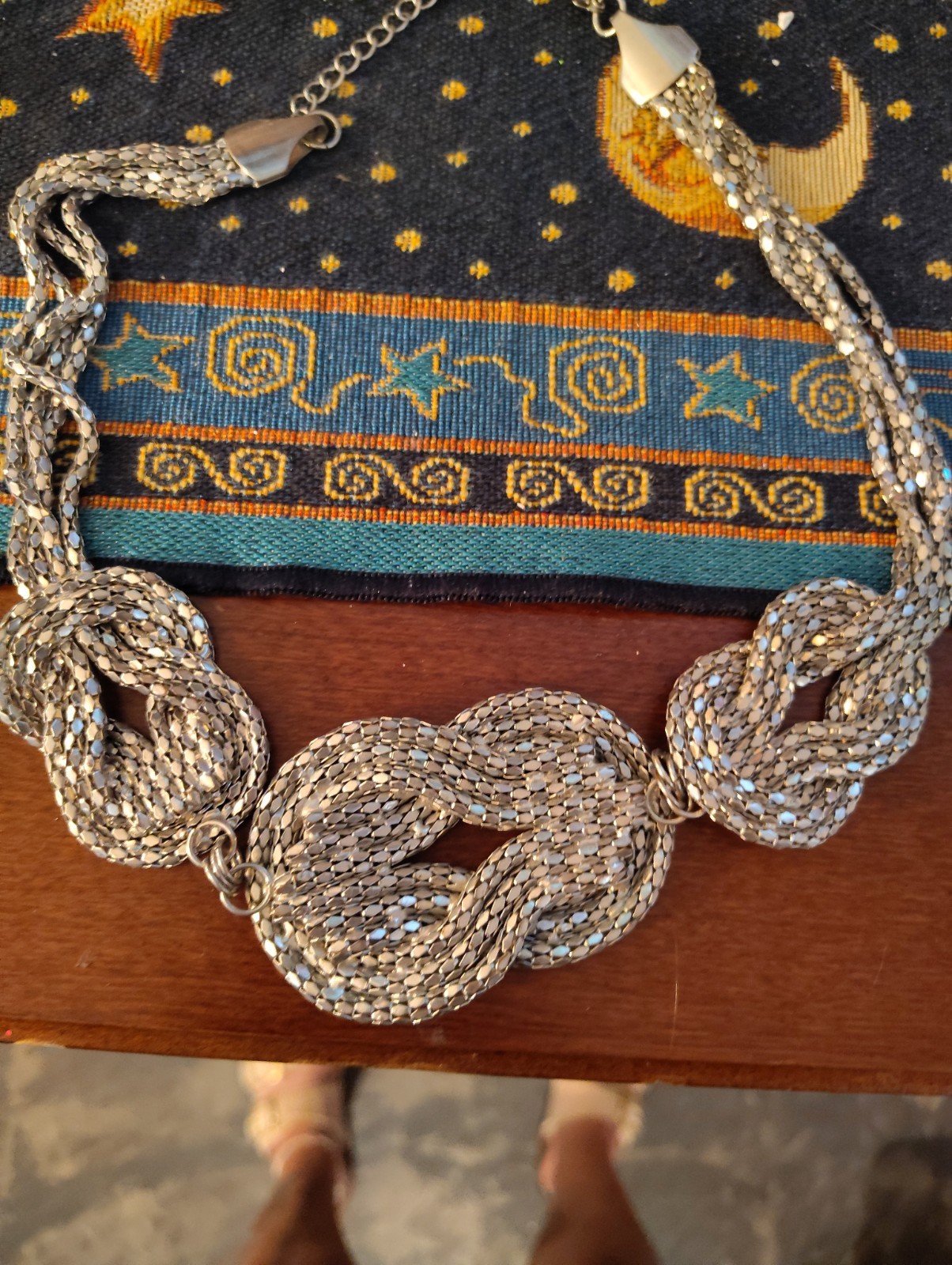 silver-tone chunky braided rope-style statement necklace three knotted details.