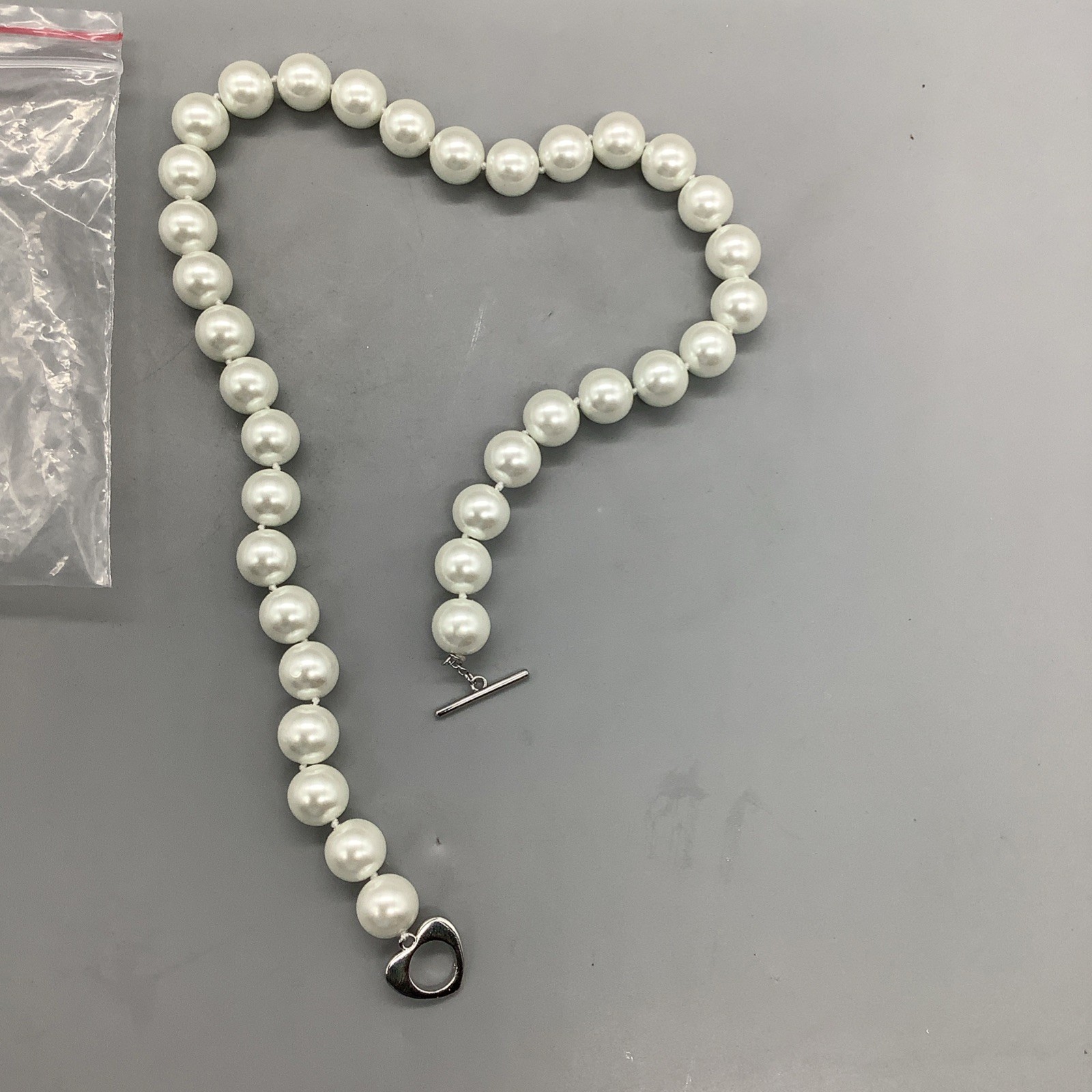 Medium Sized Pearls/Pearl Necklace w/ Heart Shaped Clasp That Connects w/ Bar