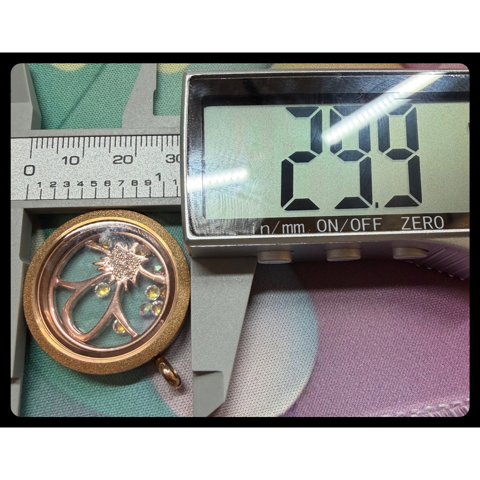 Origami Owl rose gold memory locket featuring a flower charm with crystal accent