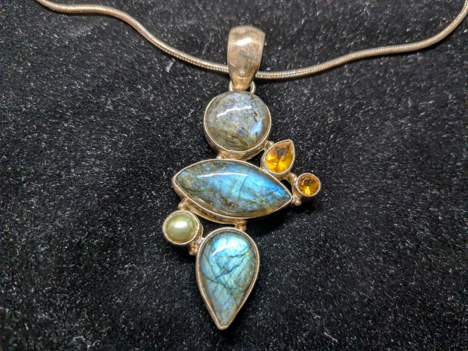 A Multi-stone cluster statement pendant necklace