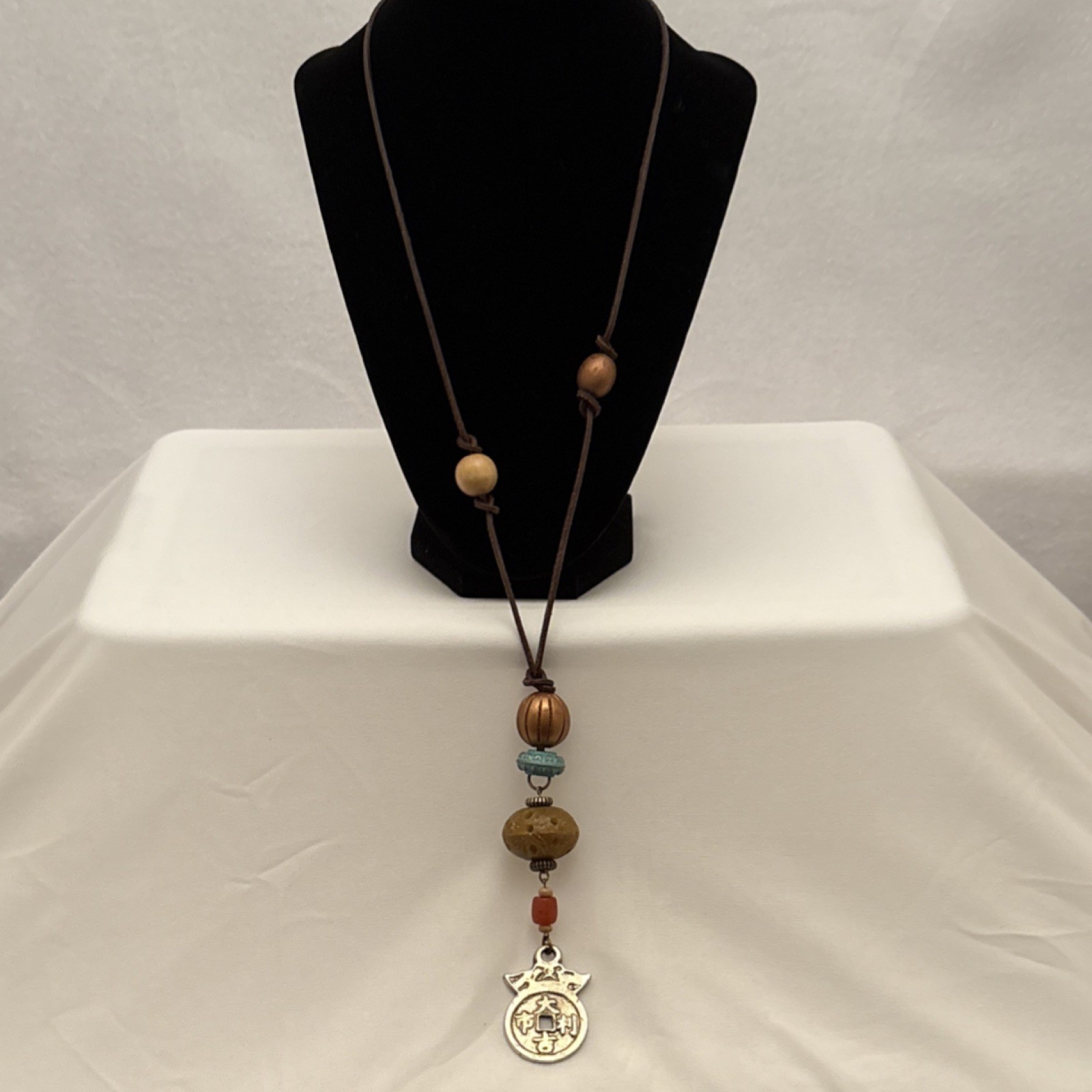 Vtg Multicolor Wood, Metal & Carved Bead Cord Necklace with Asian Charm Pendant