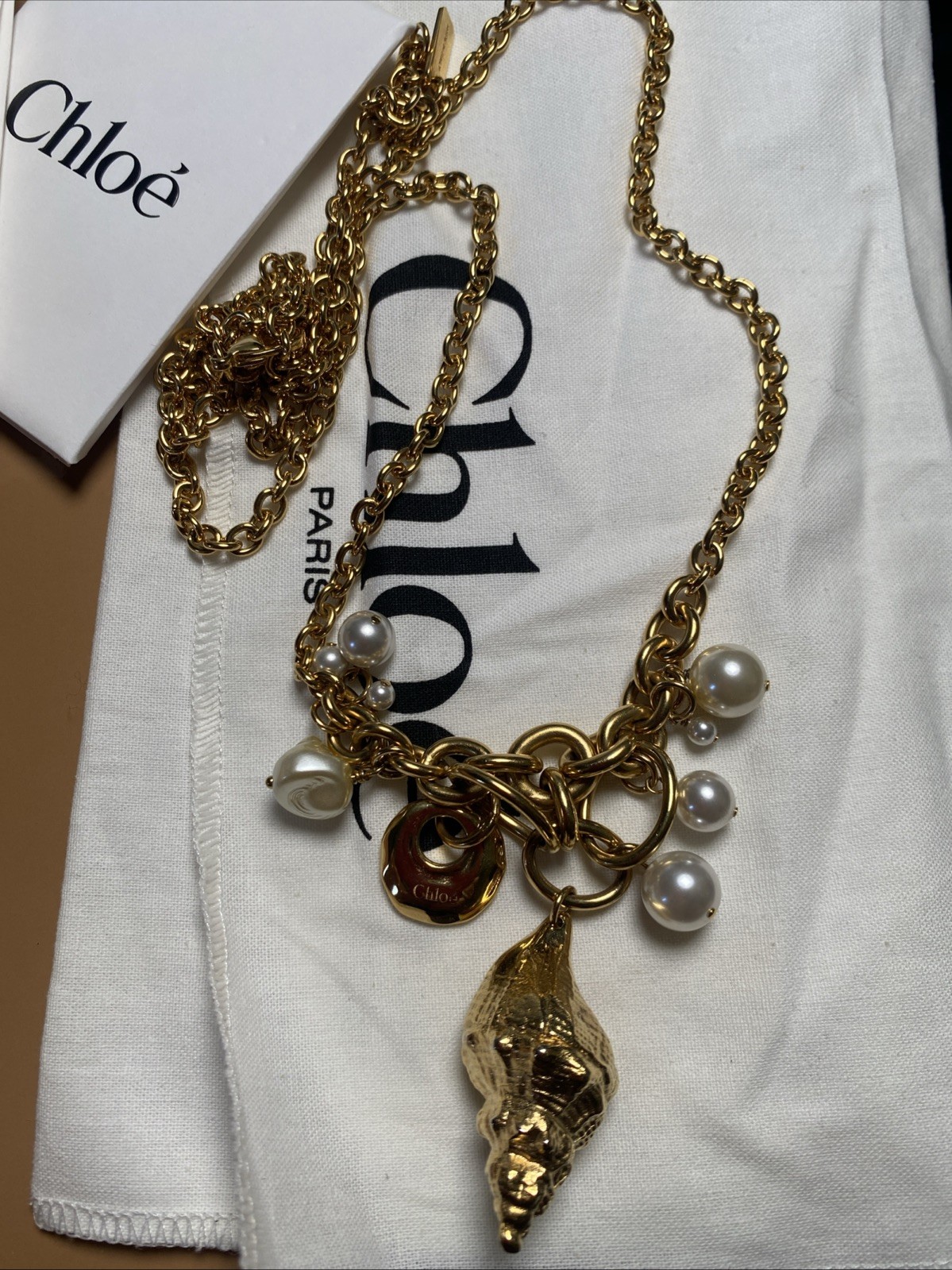 Chloe Shell pearl charm Gold Stone Designer Collection
