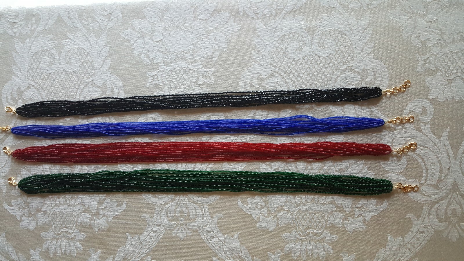 Beautiful Multi strand beaded necklace with hook. Length: 16”
