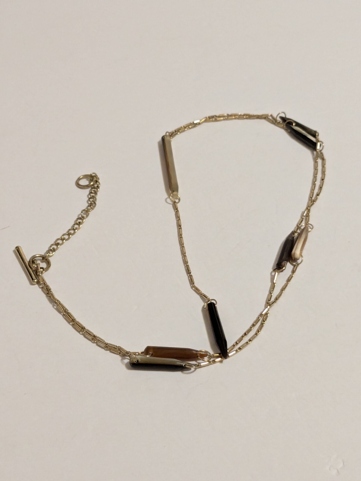 Gold Tone Y Drop Necklace With Acrylic Spear Shaped Beads. 28″ + 6.25″ Drop.