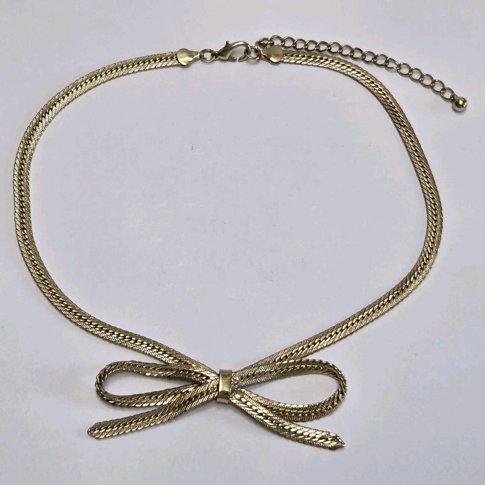 Gold Tone Bow Tie Chain Necklace 16″ – 19″