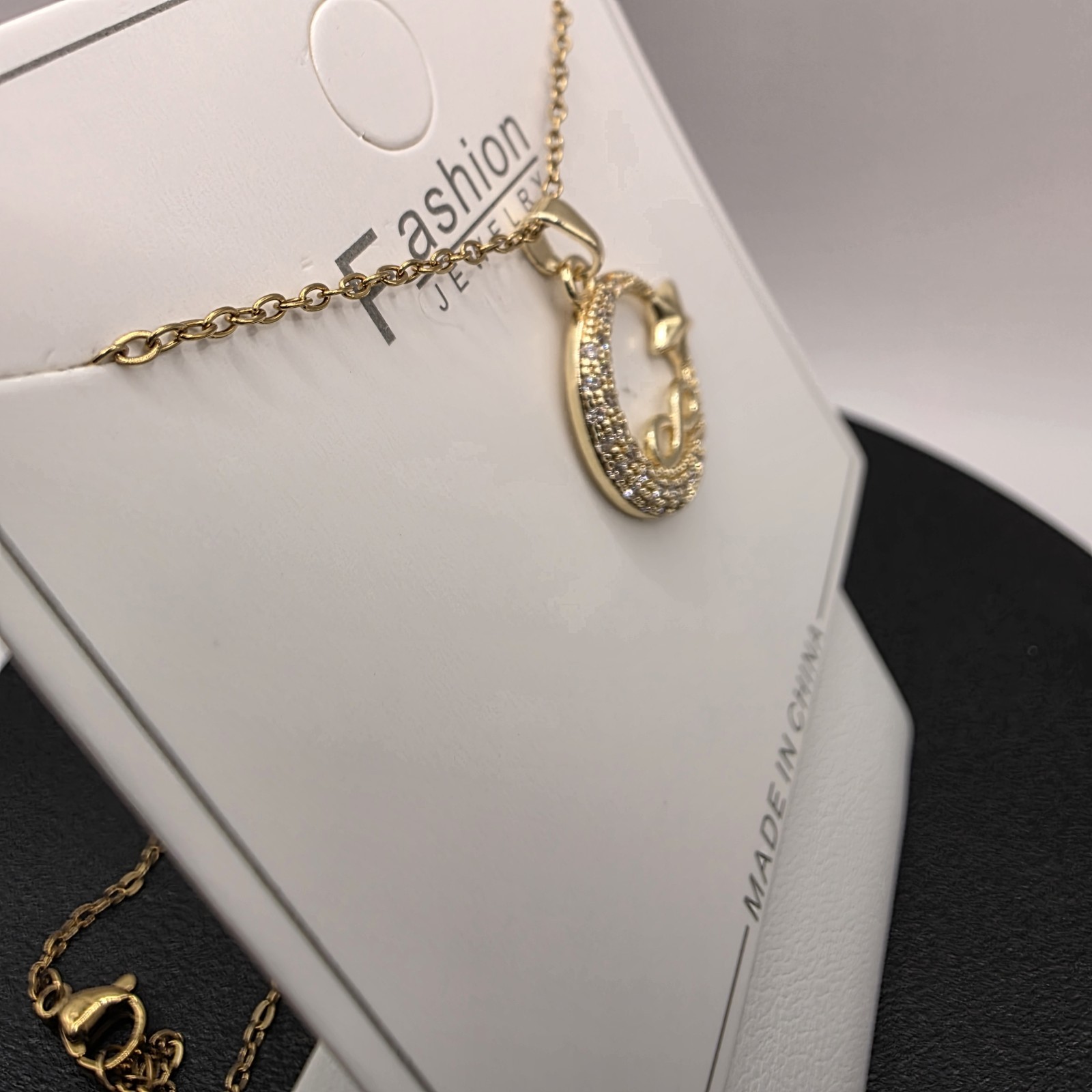 Stainless Steel Copper Plated 16″Necklace w/19mm CZ Moon, Star & Infinity…
