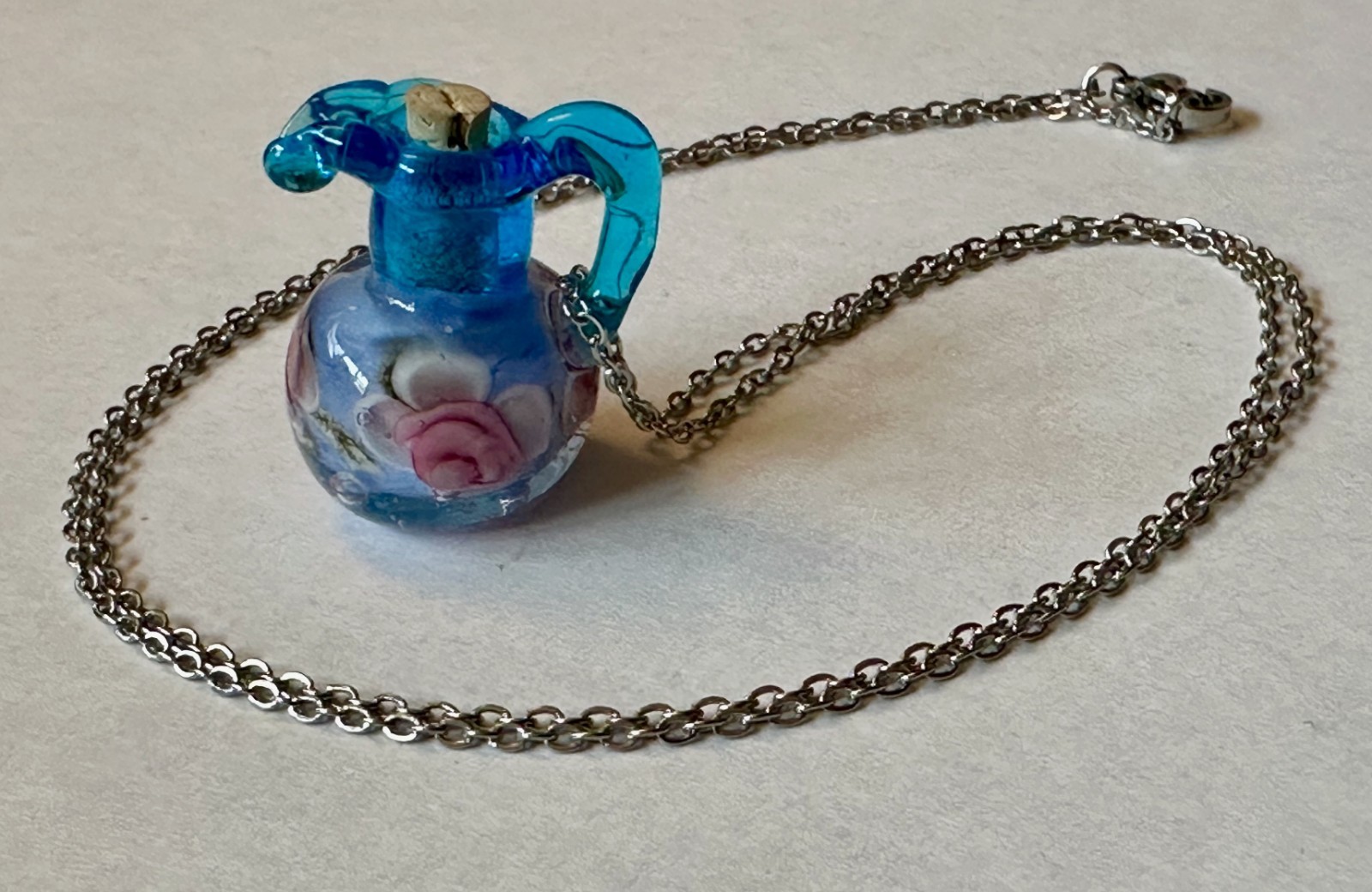 Vase Urn with handle blue glass with flower & cork pendant 1″ necklace 24″ steel
