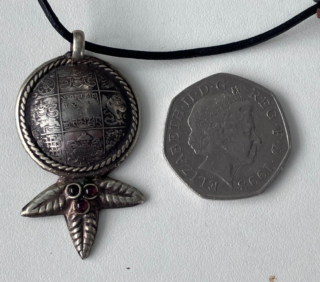 Vintage 1990s Nepal Tibet marijuana leaf coin pendant