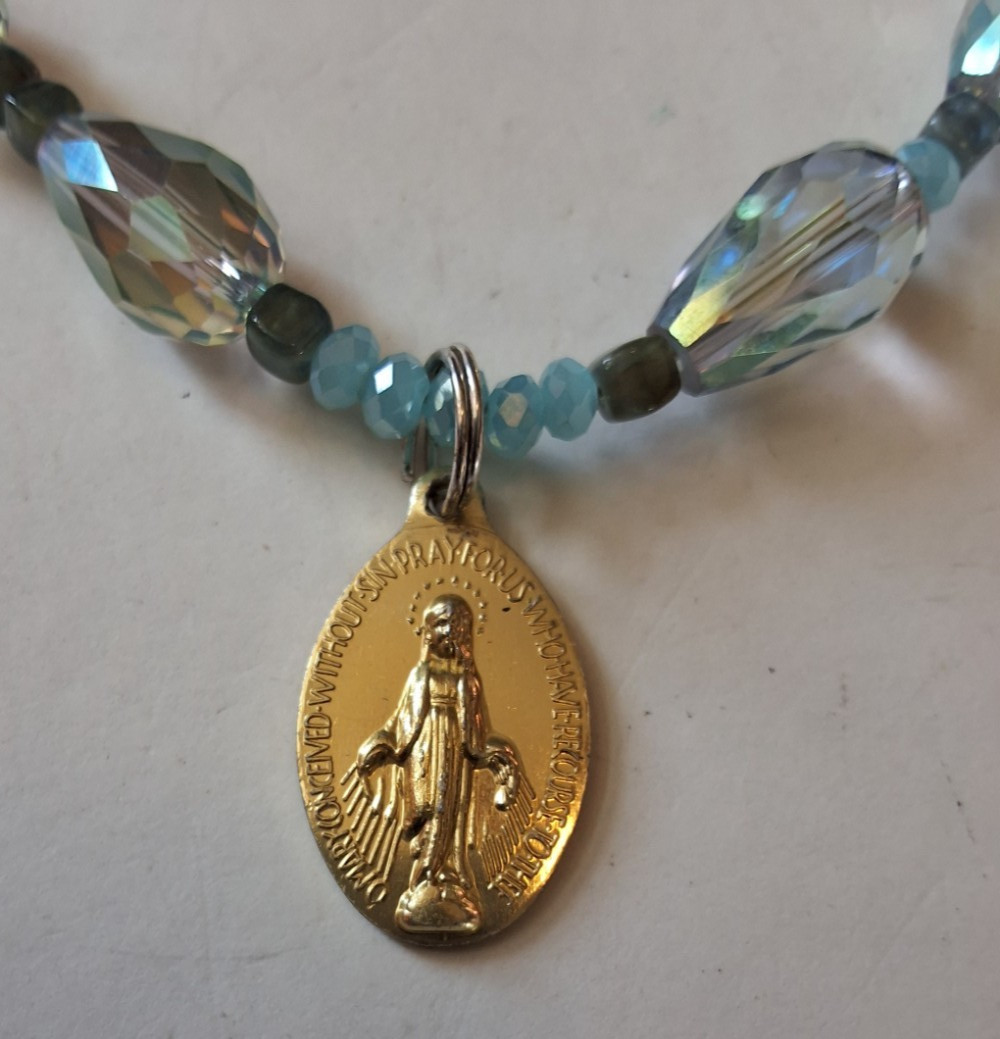 Iridescent Beaded Necklace With Gold Tone Miraculous Medal And Brooch