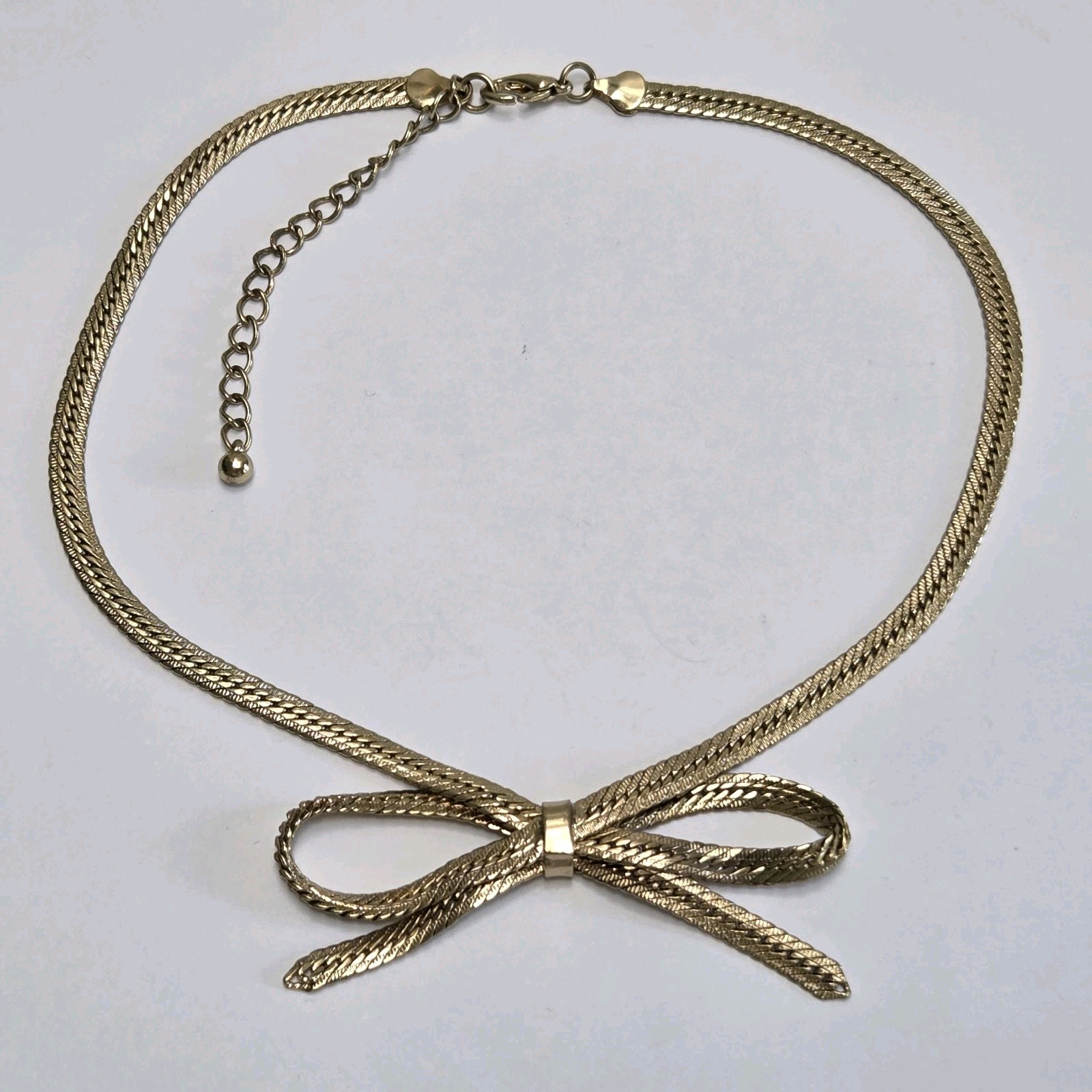 Gold Tone Bow Tie Chain Necklace 16″ – 19″