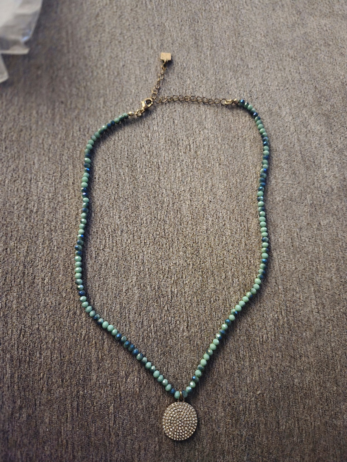 Beaded Necklace In Turquoise Color With Crystal Charm Set In Gold