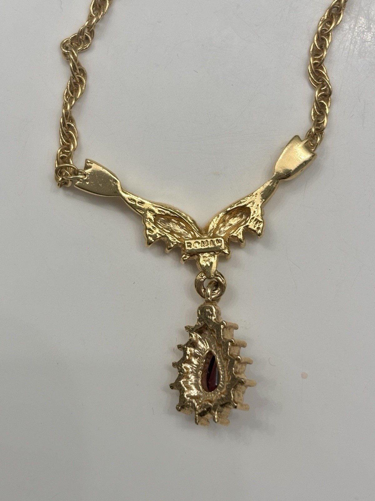 Roman 16 Inch Gold Colored Necklace With Faux Ruby Pendant