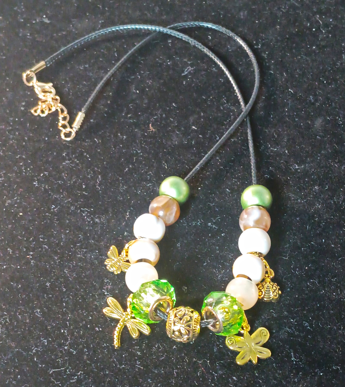 Green, Brown, & White Beaded Cord Necklace With Gold-Tone Insect Charms