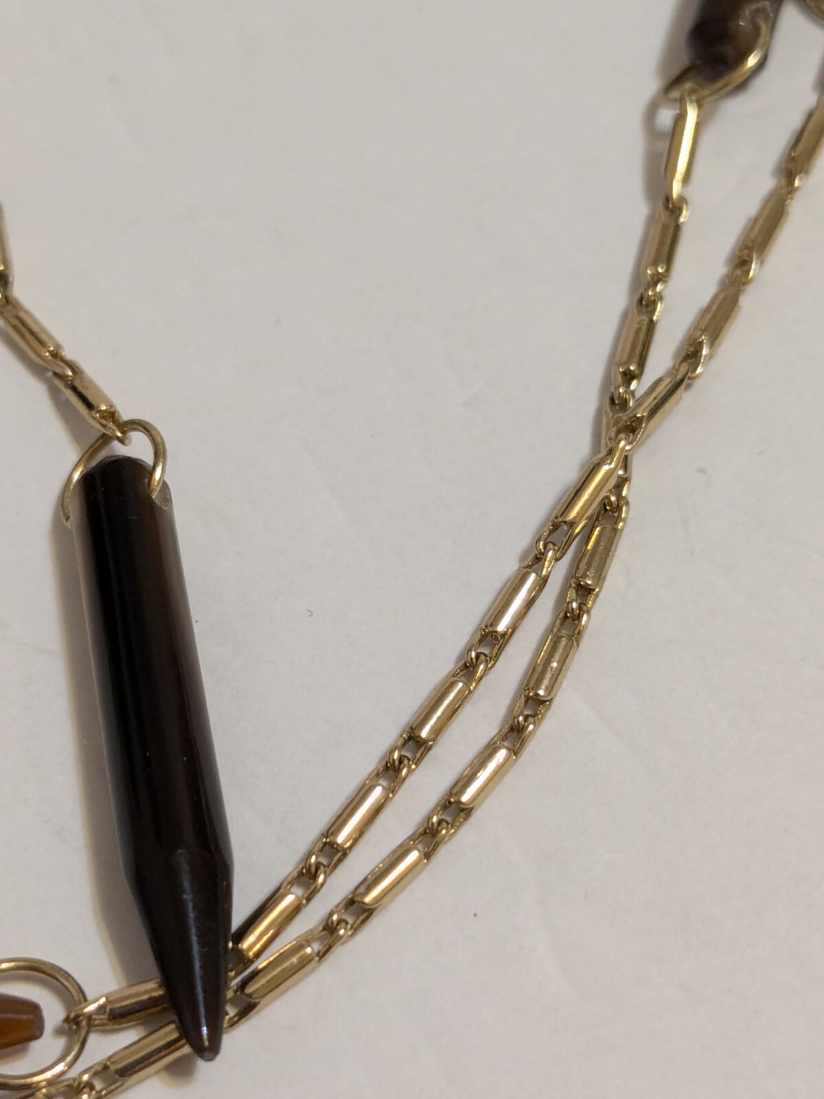 Gold Tone Y Drop Necklace With Acrylic Spear Shaped Beads. 28″ + 6.25″ Drop.