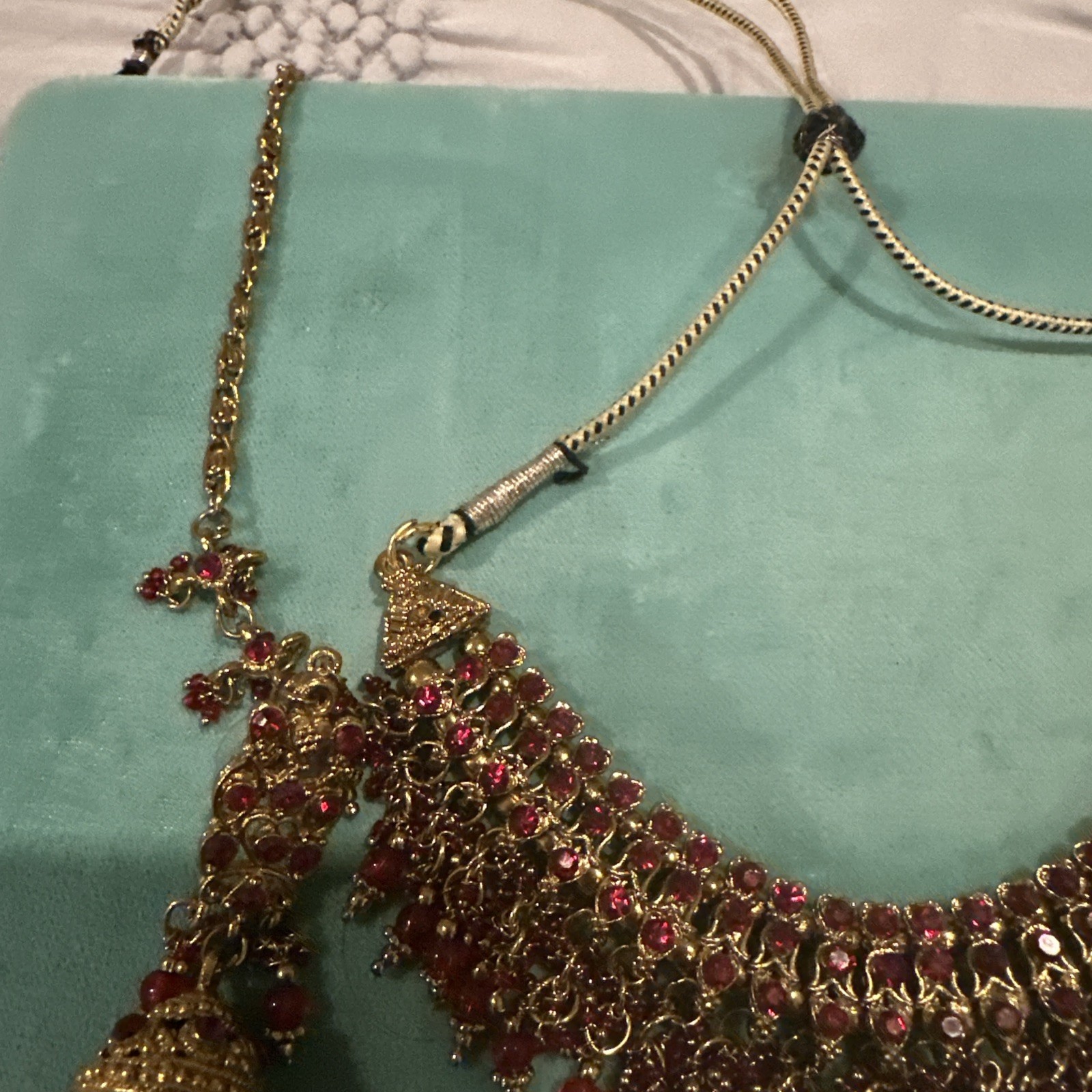 Fashion Jewelry Maroon Necklace With Jhumkas With Hair Attachment In Gold Tone