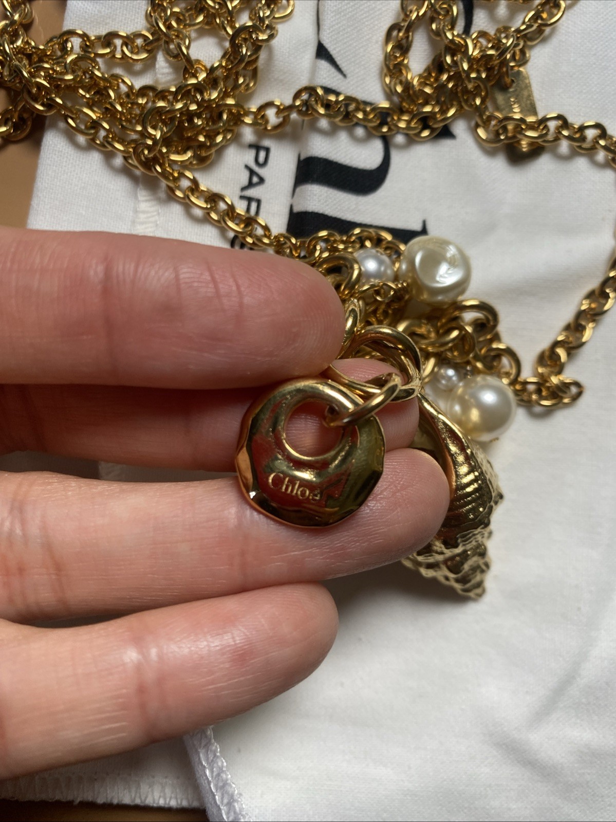 Chloe Shell pearl charm Gold Stone Designer Collection