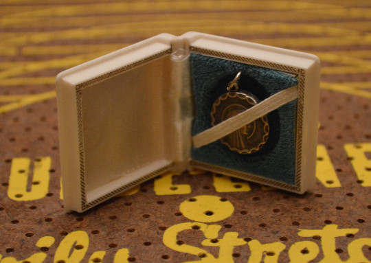 Small White and Gold Keepsake Jewelry Box with Silver Tone Religious Pendant