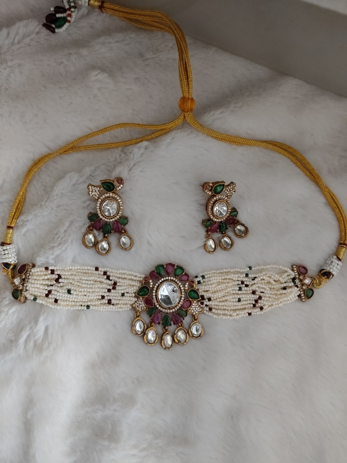 Dana Emerald Ruby Studded Multi Strand Pearl Kundan Choker Set Roz Jewellers.