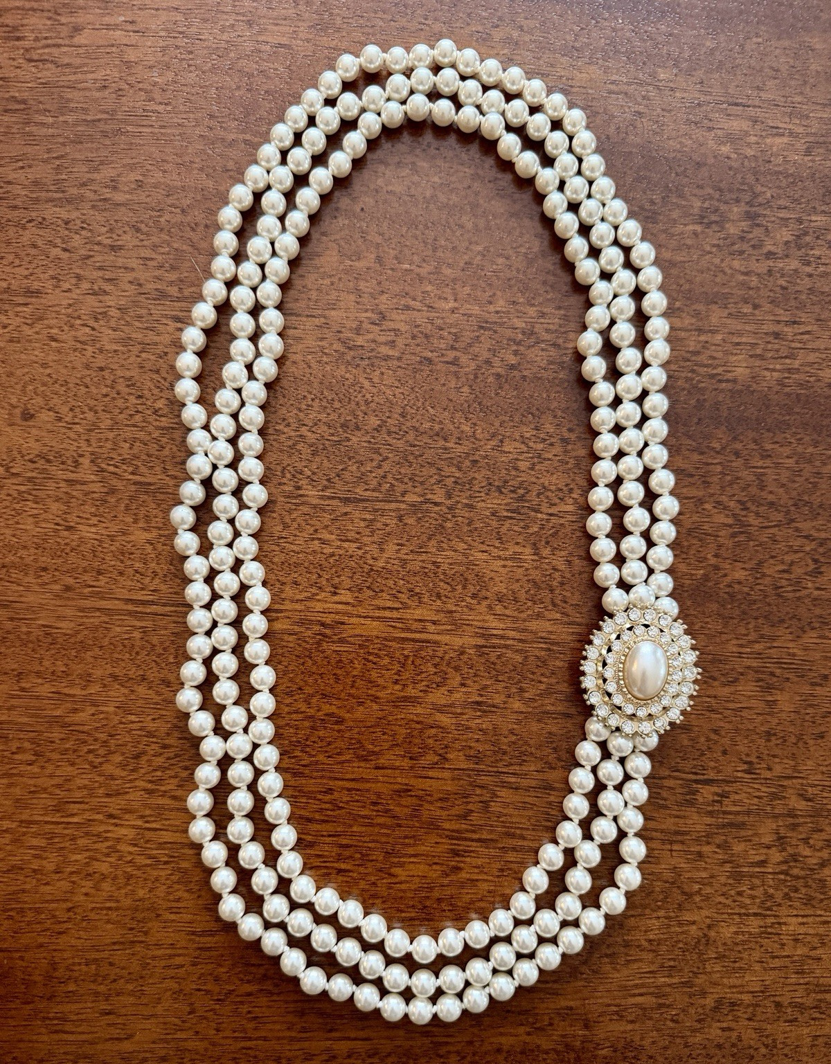 Vintage Triple‑Strand Faux Pearl Necklace w/ Ornate Oval Crystal Clasp – Classic