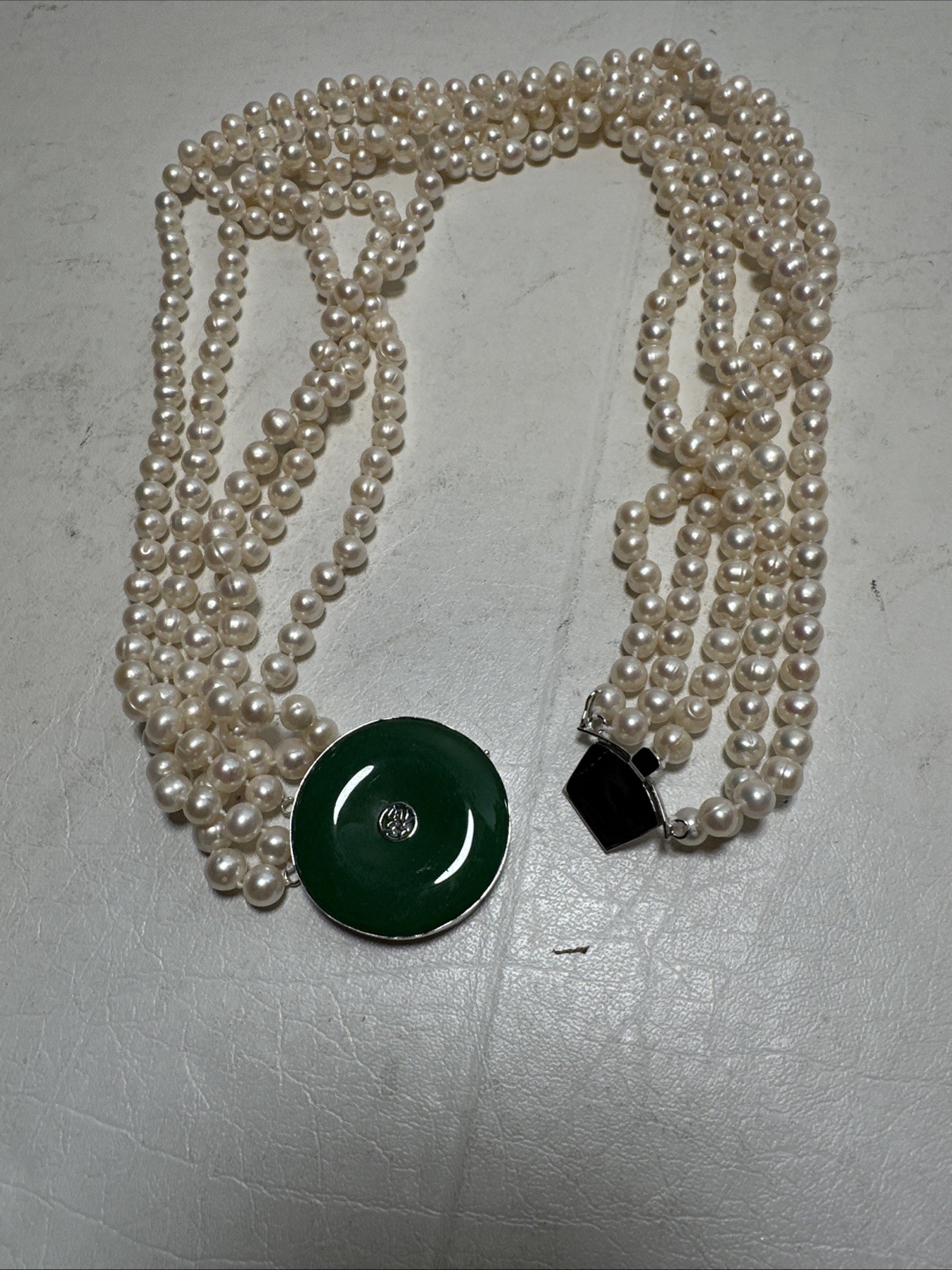 Chinese Natural Pearl Necklace, 925 Silver and a Green Stone In The Middle