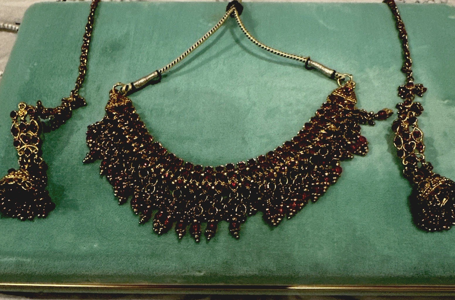 Fashion Jewelry Maroon Necklace With Jhumkas With Hair Attachment In Gold Tone