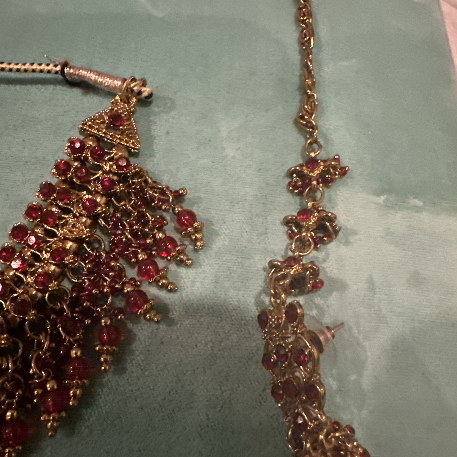 Fashion Jewelry Maroon Necklace With Jhumkas With Hair Attachment In Gold Tone