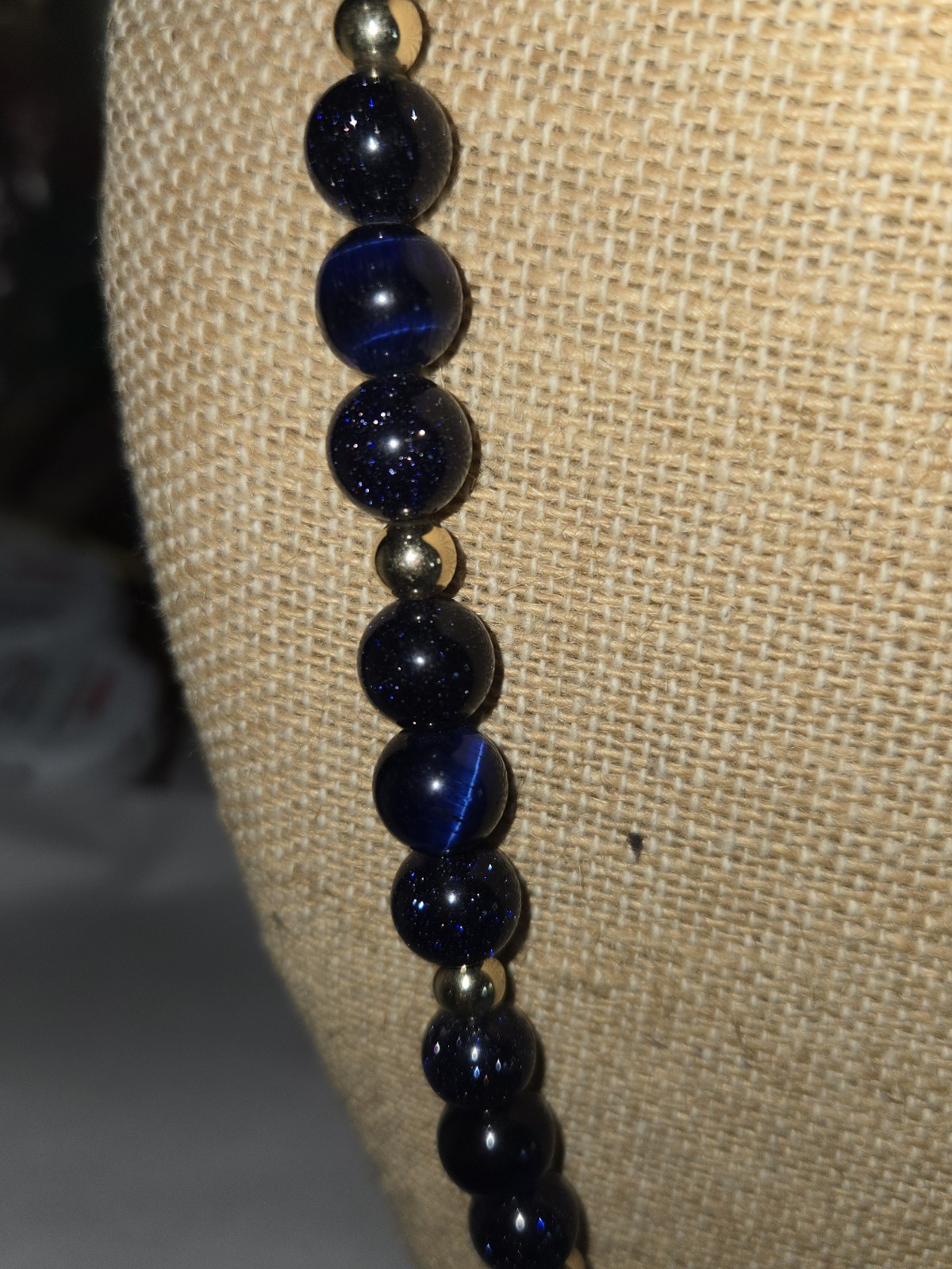 necklace round sparkly blue glass beads accented with small golden Spacer Beads