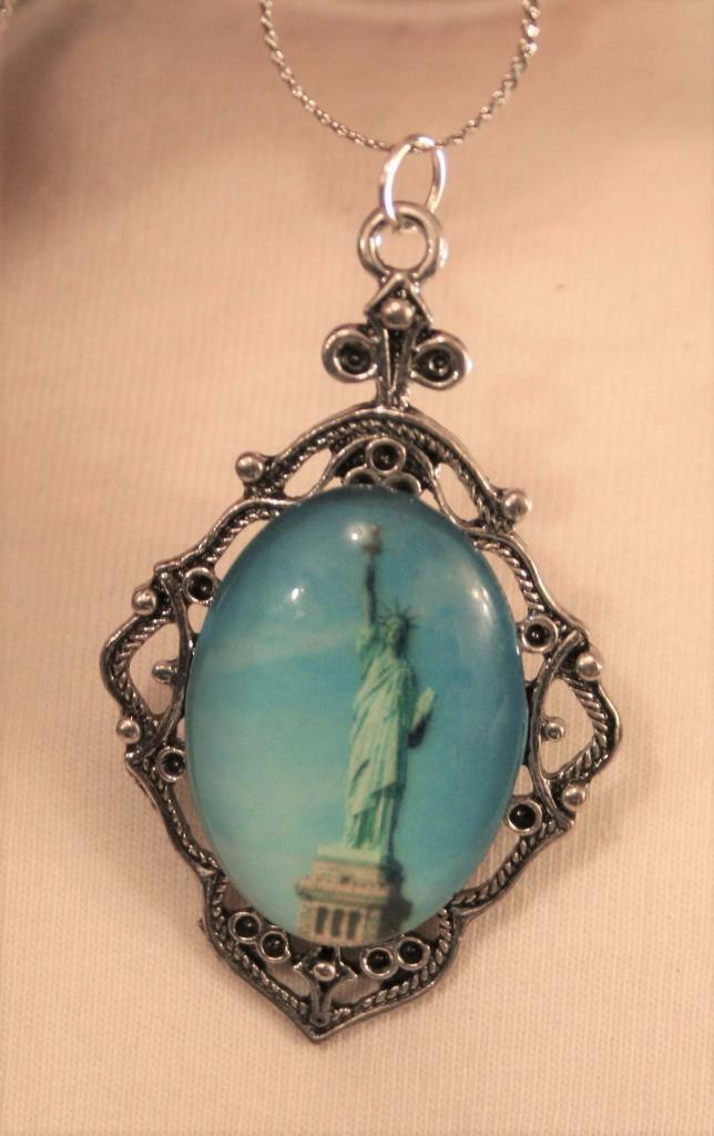 Unique Rhombus Shaped Statue of Liberty Blue Accents Silvertone Pendant Necklace