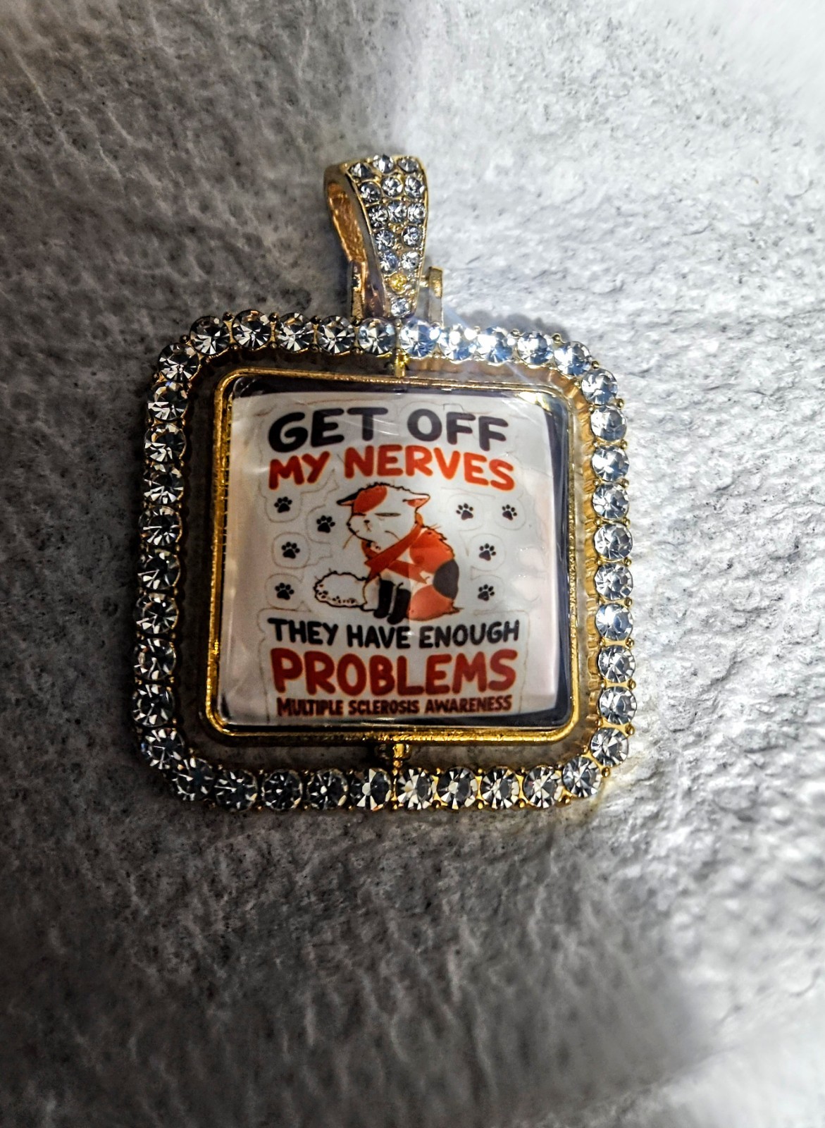 Gold Tone Square Pavé Rhinestone Crystal Pendant Charm, M.S. Awareness “GET OFF”