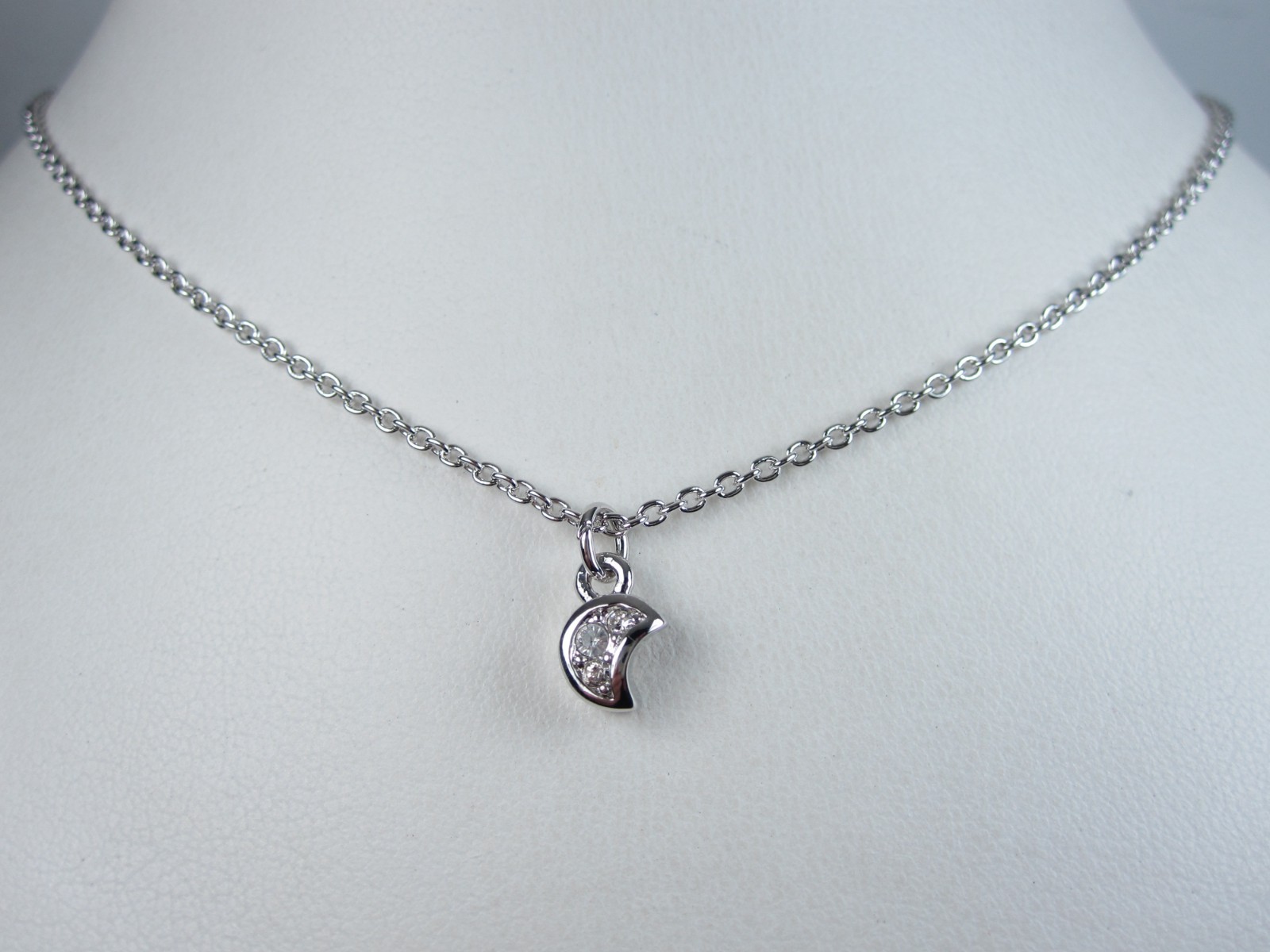 Nina Ricci Rhodium Plated Pendant with Swarovski Crystals – 16-18″ length 9379