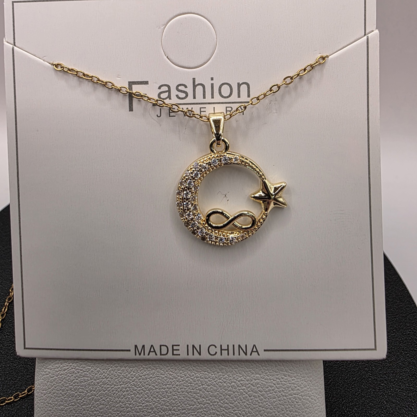Stainless Steel Copper Plated 16″Necklace w/19mm CZ Moon, Star & Infinity…