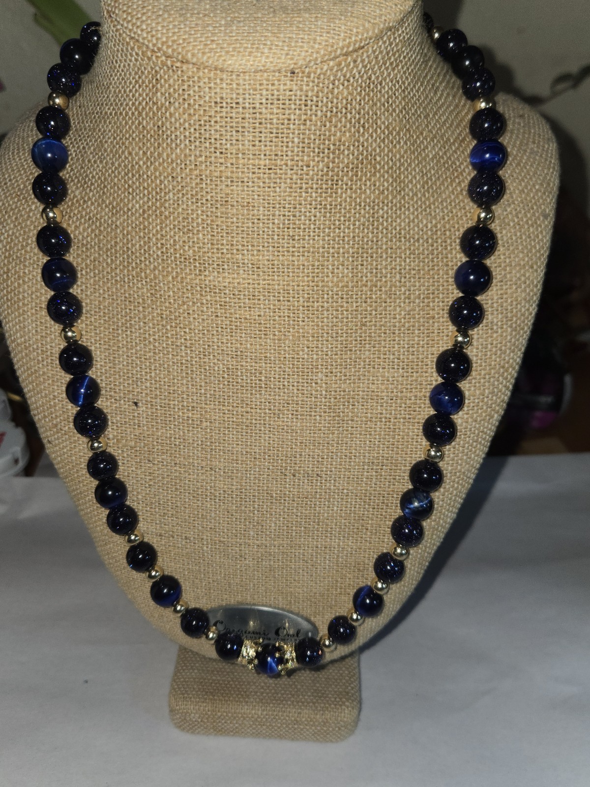 necklace round sparkly blue glass beads accented with small golden Spacer Beads