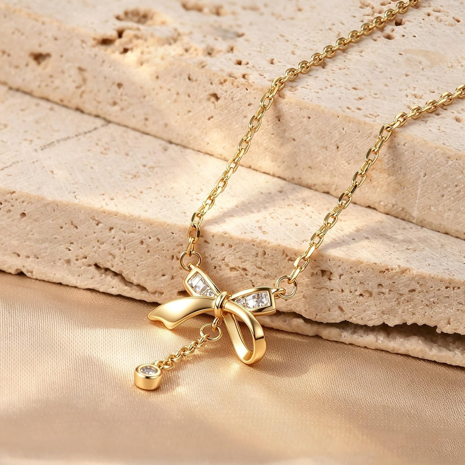 Charming Gold Necklace Set: Heart & Bow Designs with Sparkling Cubic Zirconia