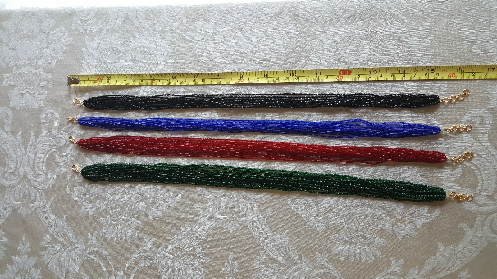 Beautiful Multi strand beaded necklace with hook. Length: 16”