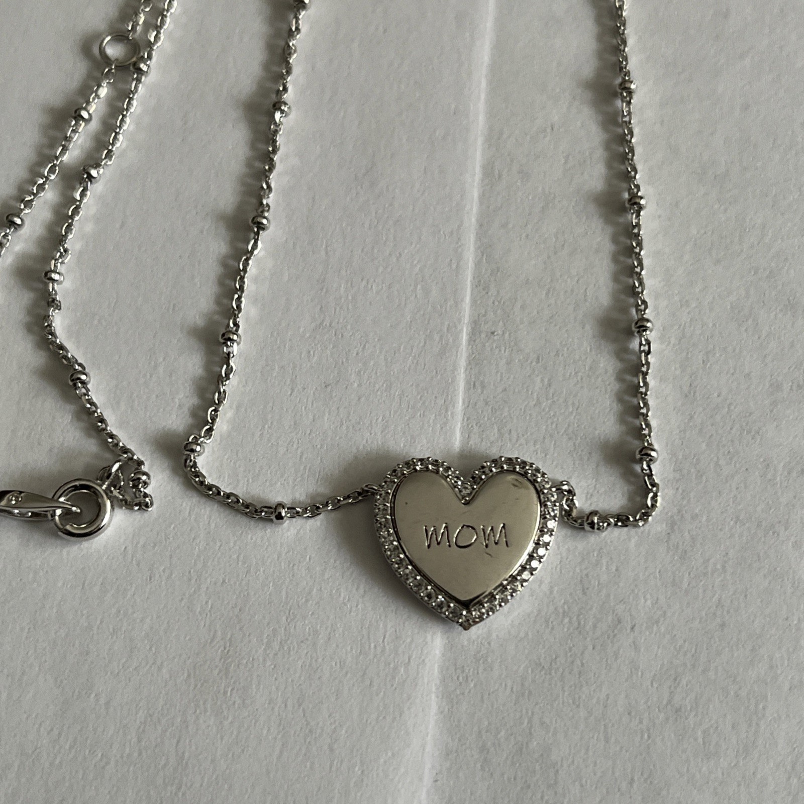 NadriLove Engraved Mom Heart Pendant Necklace in rhodium finish.